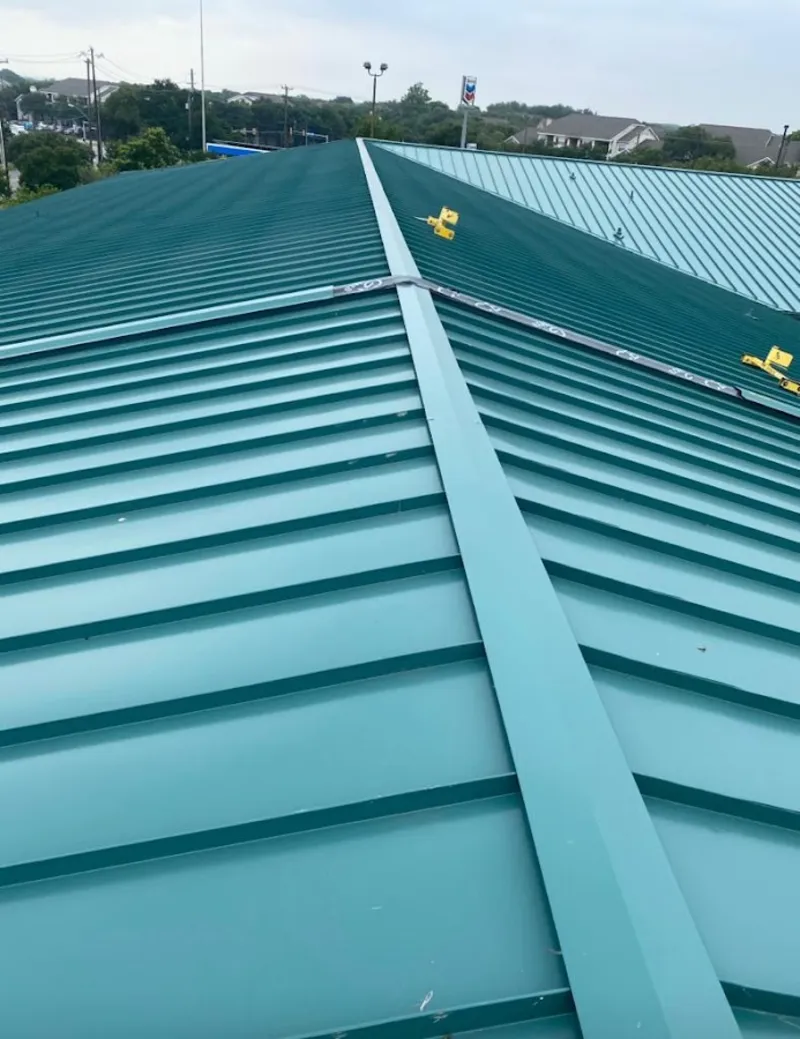 Green commercial metal roof ridge and valley for Metal Roof Repair in Albion