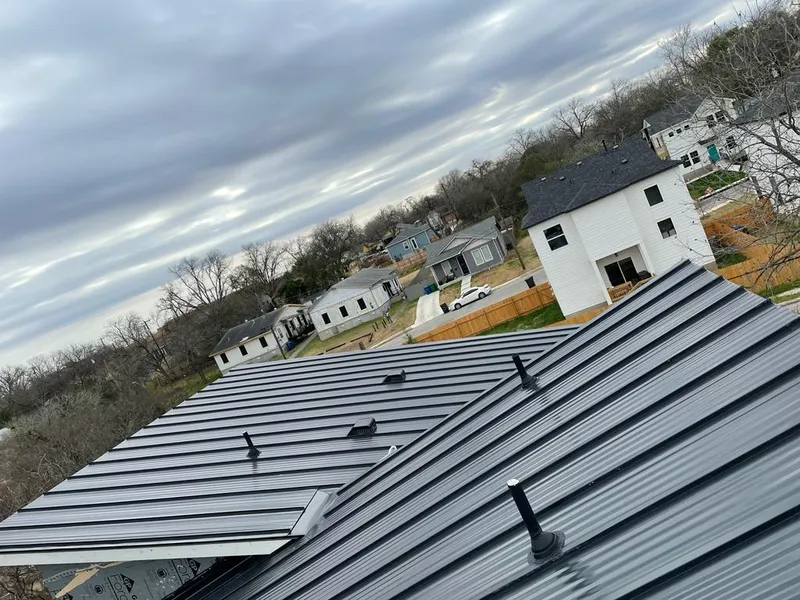 Standing seam metal roof panels with vents for Skylight Repair in Albion